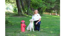 Gracie, the two-year-old yellow Lab, with Captain Roseanne Moreland.