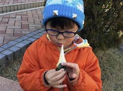 A Japanese boy enjoys a rick cake, which fire officials say should be chewed slowly. A Japanese boy enjoys a rick cake, which fire officials say should be chewed slowly.
