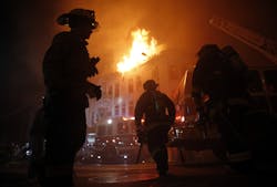 San Francisco Fire Department members fight a four-alarm fire at 22nd and Mission Street in San Francisco, Calif., on Wednesday, Jan. 28, 2015. San Francisco Fire Department members fight a four-alarm fire at 22nd and Mission Street in San Francisco, Calif., on Wednesday, Jan. 28, 2015.