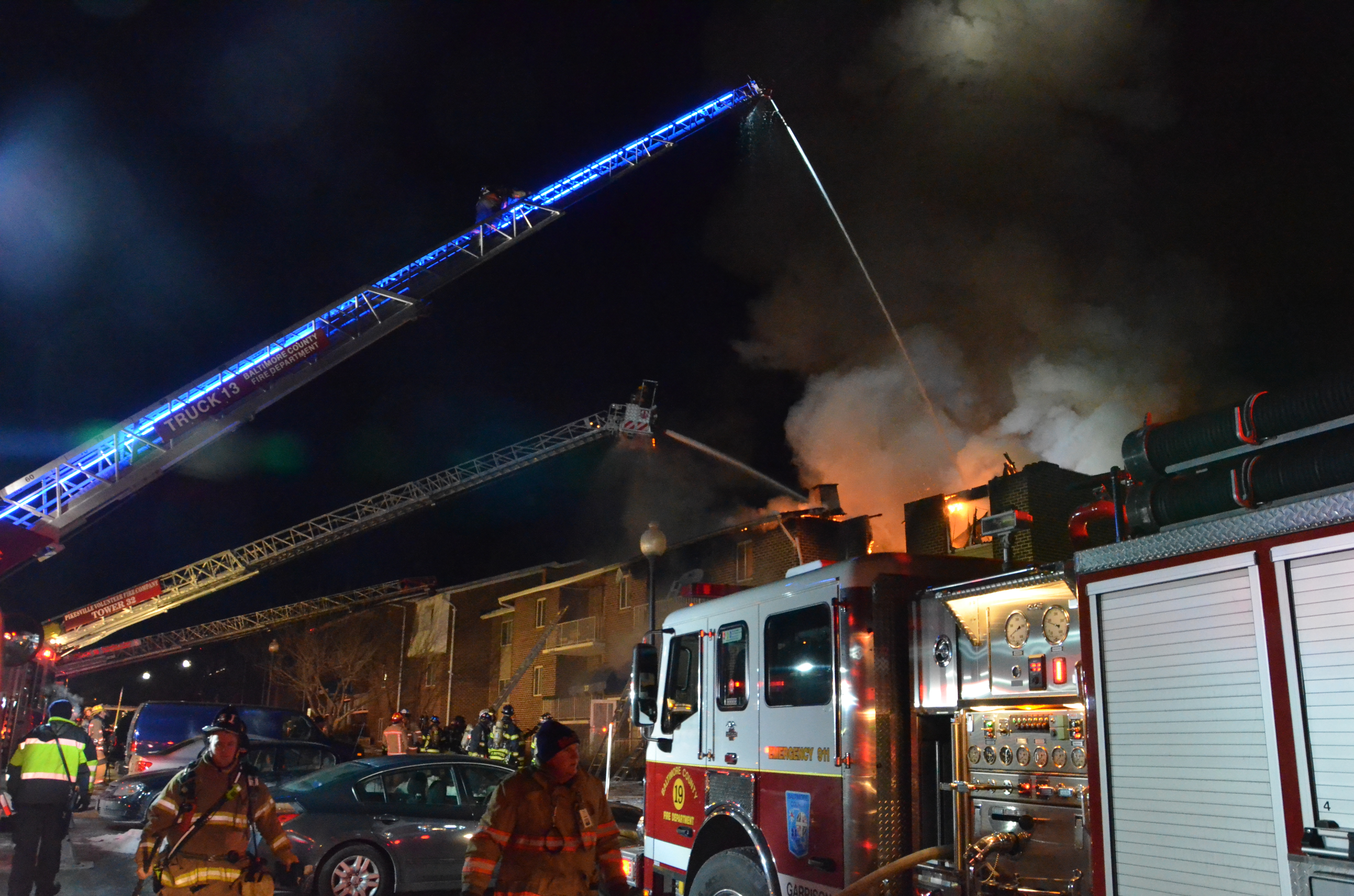 Volunteer and career firefighters work side by side at a three-alarm fire in Baltimore County, MD.