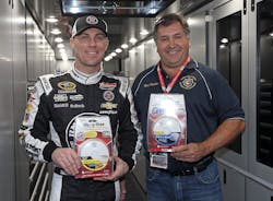 Kevin Harvick (left) makes donation of 250 Kidde smoke alarms to Rick Butcher, president of the Florida Fire Marshals and Inspectors Association.