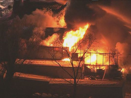 Firefighters remain on the scene of a tire warehouse blaze near BWI.