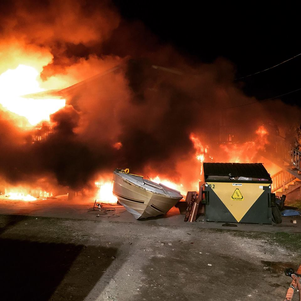 A tank full of gasoline and diesel exploded, engulfing two firefighters on a deck.