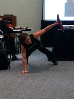 Sarah Apgar demonstrates one of the exercises designed specifically for firefighters. Sarah Apgar demonstrates one of the exercises designed specifically for firefighters.