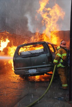 DEC. 1, 2014: SAN FERNANDO VALLEY, CA &ndash; A fire that began in a storage yard burned through dozens of cars and trash and slowed freeway traffic during rush hour. Task Force 98 attacks one part of the blaze.