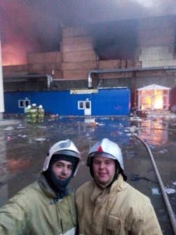 Ilya Bykov and Rostislay Krylov took this selfie in front of a burning shopping center in Kazan that killed 17 people and injured 55 others.