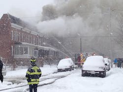 Fire has spread to nine row homes in Baltimore.