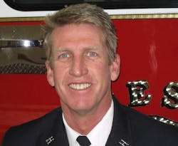 Fresno Fire Capt. Peter Dern suffered serious burns after falling through the roof at a garage fire.