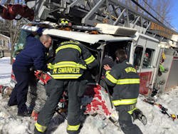 Firefighters attempt to free one of their own. Firefighters attempt to free one of their own.