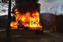 Wind blew embers to two vehicles and a field. Wind blew embers to two vehicles and a field.