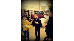 Michael, right, is a young fan of Plymovent exhaust removal systems and the company recently acknowledged him as a fan.