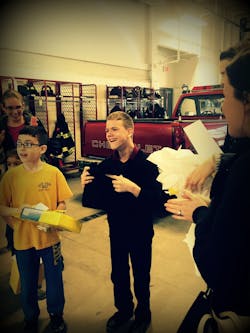 Michael, right, is a young fan of Plymovent exhaust removal systems and the company recently acknowledged him as a fan. Michael, right, is a young fan of Plymovent exhaust removal systems and the company recently acknowledged him as a fan.