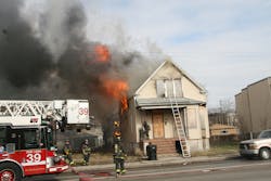 MARCH 29: CHICAGO, IL &mdash; A dozen fire companies responded to a blaze that destroyed a vacant home. Crews encountered heavy fire from the 2 1/2-story home and used a defensive attack, including Tower Ladder 39&apos;s elevated master stream.