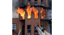 Boston firefighters work a multi-alarm brownstone fire that claimed Lt. Edward Walsh and Firefighter Michael Kennedy on March 26, 2014.