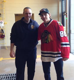 Chicago Blackhawk Patrick Kane brought pizza and wings for Downers Grove Firefighter Kevin O'Leary (right) and his crew after his wife sent out a tweet. Chicago Blackhawk Patrick Kane brought pizza and wings for Downers Grove Firefighter Kevin O'Leary (right) and his crew after his wife sent out a tweet.