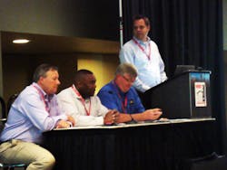 Talking about new fire station construction pitfalls, from left to right are David Hartman, William Pearson, Curt Pronk, and Craig Carter at the podium. Talking about new fire station construction pitfalls, from left to right are David Hartman, William Pearson, Curt Pronk, and Craig Carter at the podium.