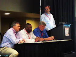 Talking about new fire station construction pitfalls, from left to right are David Hartman, William Pearson, Curt Pronk, and Craig Carter at the podium.