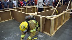A member of the Gainesville, Fla., Fire Department moves through the Fire-Rescue Competition course.