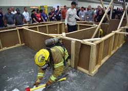 A member of the Gainesville, Fla., Fire Department moves through the Fire-Rescue Competition course. A member of the Gainesville, Fla., Fire Department moves through the Fire-Rescue Competition course.