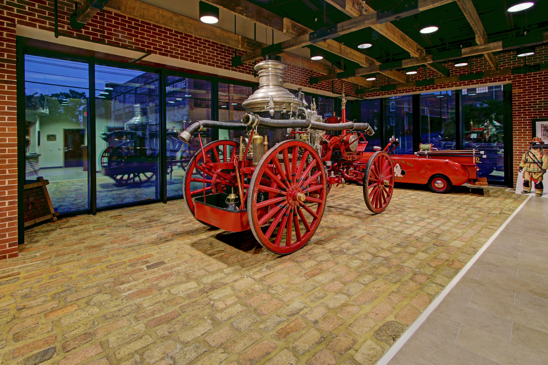 The station features a 'glass box museum' style layout and uses reclaimed bricks and timber in the design.