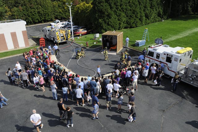 As part of the Hauppauge, NY, Fire Department&rsquo;s annual fire safety and prevent event, firefighters prepare to start a room and contents fire to demonstrate the effectiveness of home fire suppression systems.