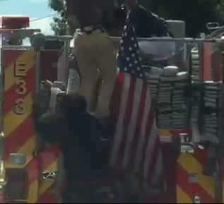 Three men were charged after jumping onto a D.C. fire engine to fight.