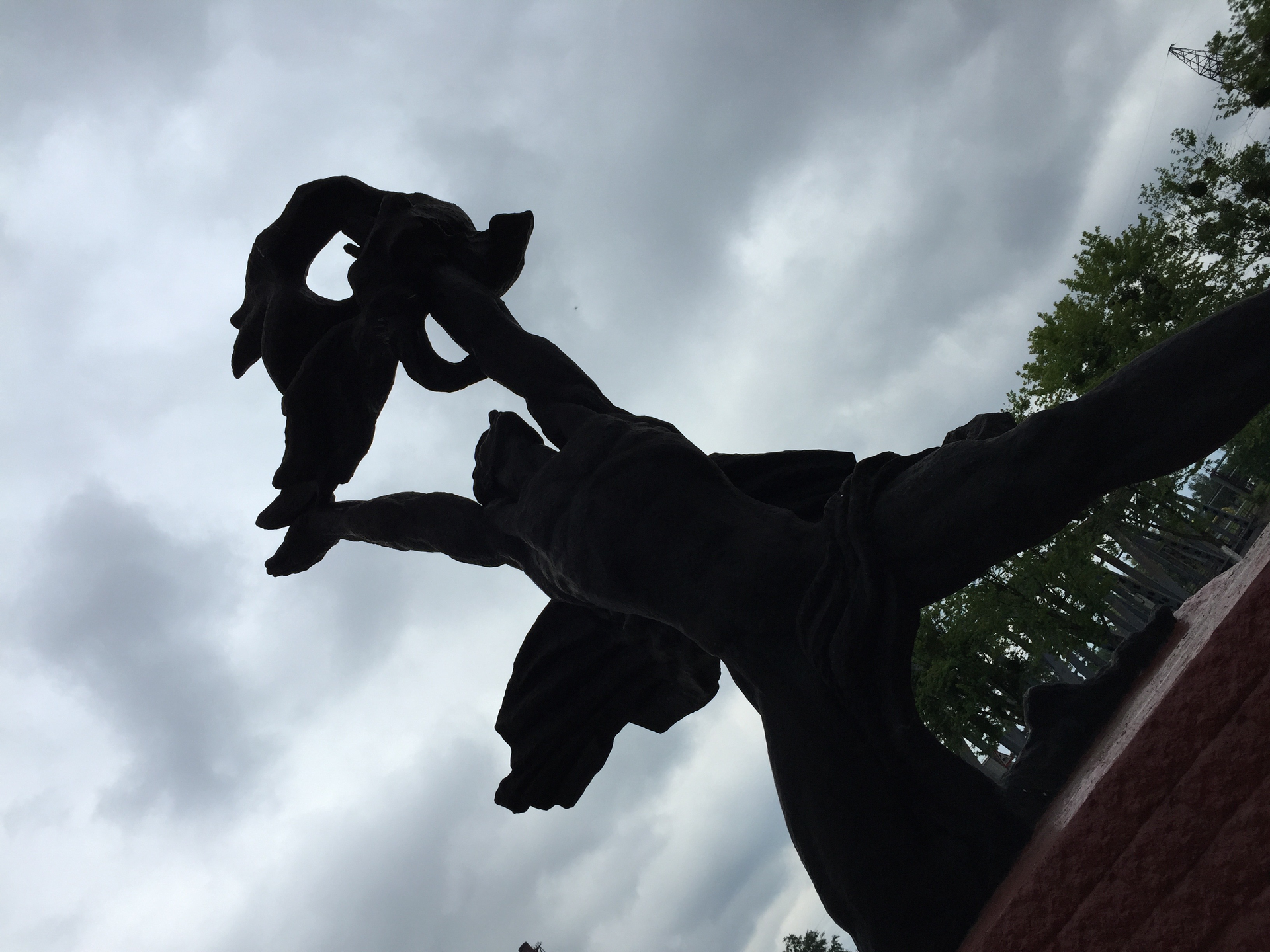 A statue of Prometheus stealing fire from the gods stands near the Chernobyl Firefighters Memorial.