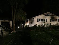 Heavy fire was showing from this house. Heavy fire was showing from this house.