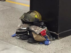 Lansing Firefighter Dennis Rodeman's gear sits outside a fire station. Lansing Firefighter Dennis Rodeman's gear sits outside a fire station.