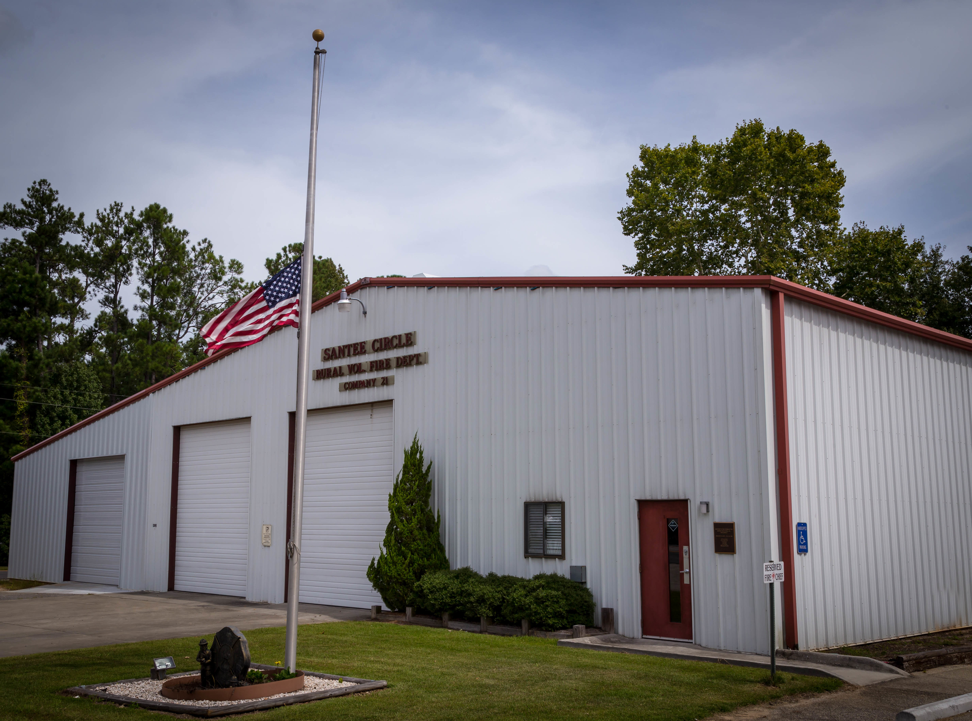 The flag flies at half mast in honor of Santee Circle Battalion Chief Maywood Gaskins.
