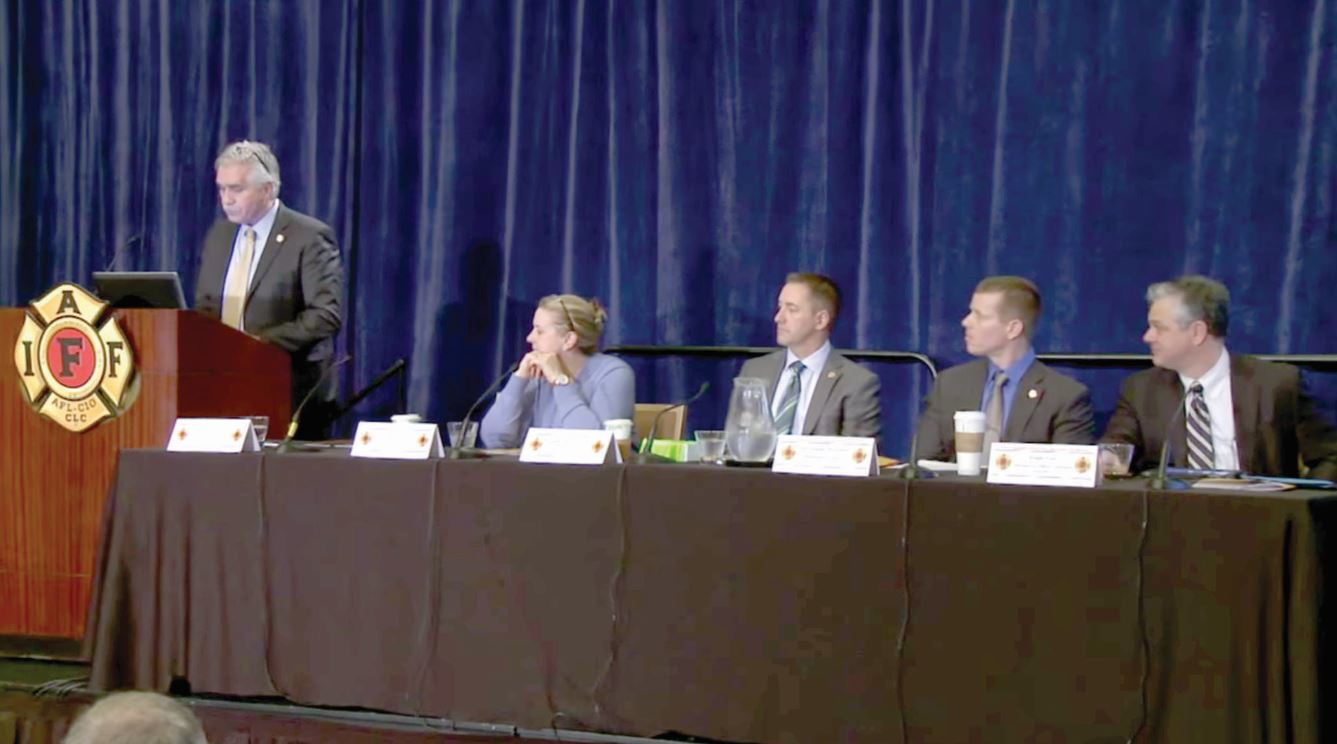 Pat Morrison, IAFF Assistant General President for Health, Safety and Medicine (left) briefs career firefighters on the increasing problem of post-traumatic stress and suicide in the fire service during the IAFF Redmond Symposium in Washington, D.C. this summer.