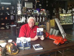 Dr. Burton Clark with his book, 'I Can't Save You, But I'll Die Trying.' Dr. Burton Clark with his book, 'I Can't Save You, But I'll Die Trying.'