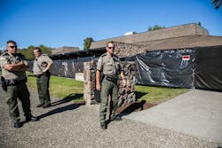 Officers stand outside a building where students were killed. The massacre is taking a toll on responders. Officers stand outside a building where students were killed. The massacre is taking a toll on responders.