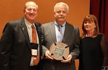 Mike Wieder, IFSTA Executive Director, left is pictured with Mr. and Mrs. Kevin Roche.