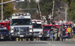 Ambulances leave the hectic scene of a mass shooting at the Inland Regional Center in San Bernardino, Calif., on Wednesday, Dec. 2, 2015.