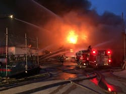 Baltimore firefighters battle a three-alarm fire on New Year's Eve. Baltimore firefighters battle a three-alarm fire on New Year's Eve.