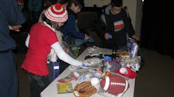 Students learn how to create a disaster bag that includes food, flashlights, batteries and activities to keep children occupied.
