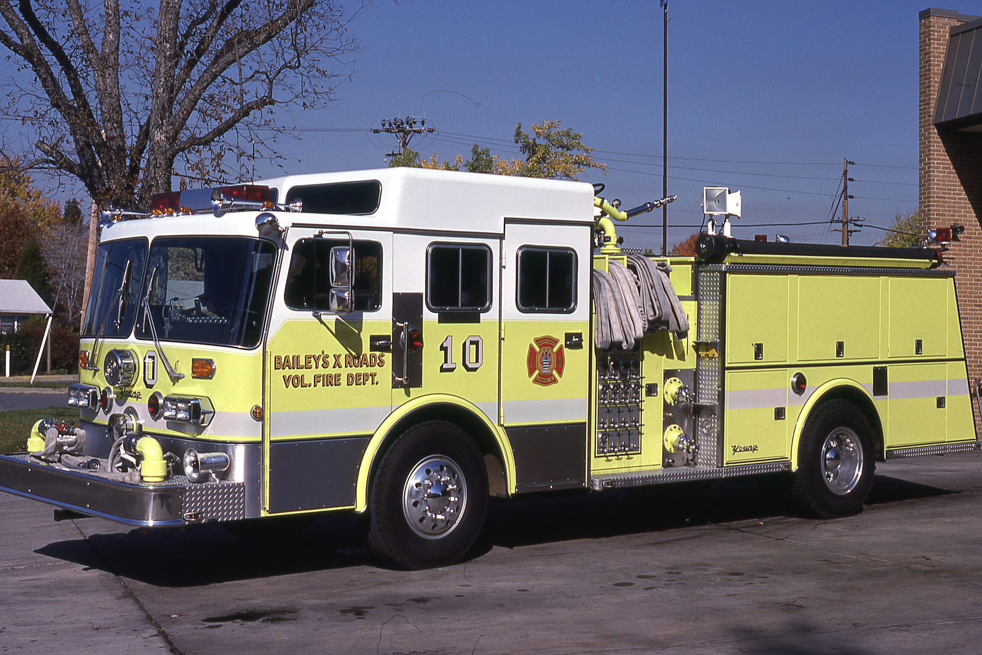 Young produced the first four-door, raised-roof cab pumper to the Bailey&rsquo;s X Roads Fire Department in 1983. Note the four crosslay attack lines and hydraulic valve controls at the pump panel.