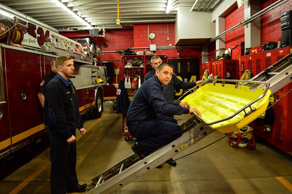Prince George's County Firefighter Miguel Ocasio Jr., on ladder, explains the rescue effort.