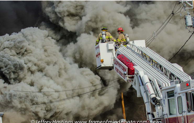 A three-alarm fire destroyed a vacant building in Goffstown, N.H.
