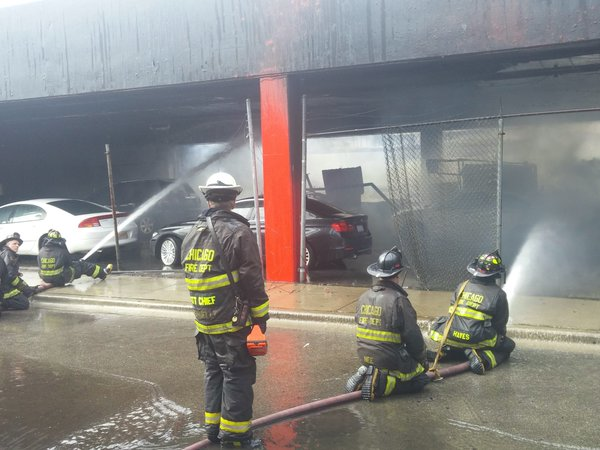 Firefighters work to control flames.