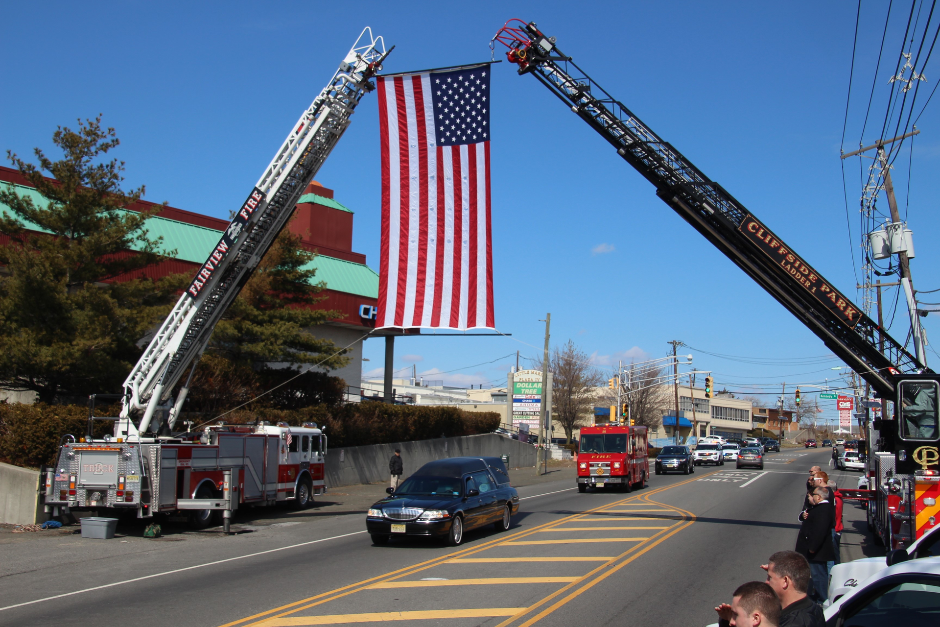An American flag is hung between aerial ladders from the Cliffside Park and Fairview fire departments during Rubin's March 6 funeral.