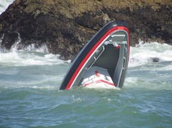 Only the bow of the San Francisco fire boat is visible after it capsized.