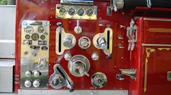 This pump panel on a 1962 American La France is somewhat Spartan when compared to today’s electronic versions. Note the discharge gauges at the top of the panel and engine controls on the left-hand side. This pump panel on a 1962 American La France is somewhat Spartan when compared to today’s electronic versions. Note the discharge gauges at the top of the panel and engine controls on the left-hand side.