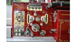 This pump panel on a 1962 American La France is somewhat Spartan when compared to today&rsquo;s electronic versions. Note the discharge gauges at the top of the panel and engine controls on the left-hand side.
