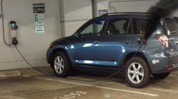 This electric plug-in vehicle is in a public parking garage. It is plugged into the wall-mounted charging station. A fire is evident at the end of the charging cable where it is connected to the charging receptacle on the vehicle. Recommended tactics include: Isolate and secure the immediate area, request power shutdown, protect exposures, chock wheels of vehicle if safe to do so, and initiate additional activities as appropriate once power is confirmed shut off to the charging station. This electric plug-in vehicle is in a public parking garage. It is plugged into the wall-mounted charging station. A fire is evident at the end of the charging cable where it is connected to the charging receptacle on the vehicle. Recommended tactics include: Isolate and secure the immediate area, request power shutdown, protect exposures, chock wheels of vehicle if safe to do so, and initiate additional activities as appropriate once power is confirmed shut off to the charging station.