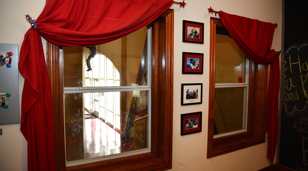 These windows are used to escape the smoke-filled bedroom. Below the windows are a roof where children can take refuge.