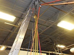 Photo 2: Bad weather doesn't mean you cannot train on the basics with ladders inside the station. When using ladders in the apparatus bay, consider where the tip of the ladder will be positioned when raising, and what function it will serve once the ladder is raised. Photo 2: Bad weather doesn't mean you cannot train on the basics with ladders inside the station. When using ladders in the apparatus bay, consider where the tip of the ladder will be positioned when raising, and what function it will serve once the ladder is raised.