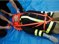 Photo 5: Multiple methods of packaging for patient removal must be practiced. A drill that incorporates a manikin inside the station can help crews adapt as necessary.