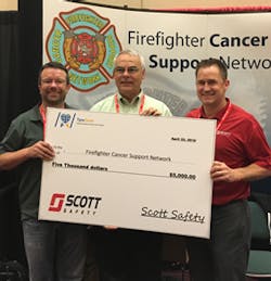 Scott Safety representatives present a $5,000 check to Firefighter Cancer Support Network in Burbank, CA.